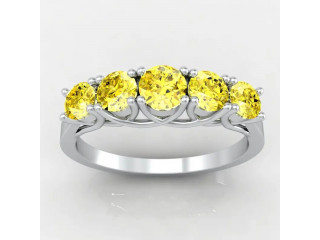 Timeless Yellow Sapphire Four Prong Engagement Ring (0.65 Carat)